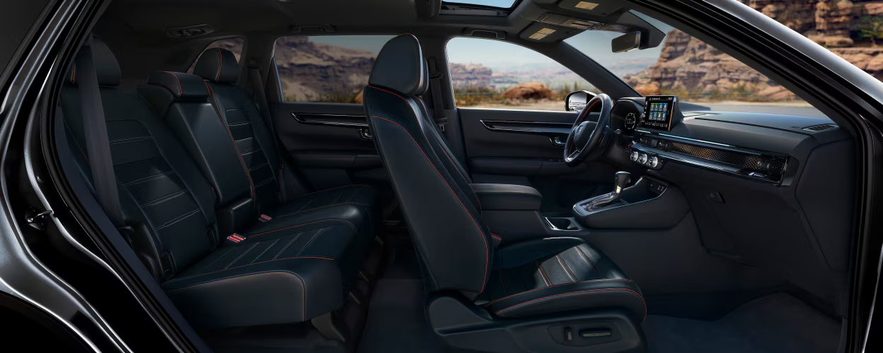 Spacious interior space CR-V 2024. Generous cargo capacity CR-V. Comfortable passenger space CR-V 2024. Honda CR-V trunk modularity. Flexible interior layout CR-V. Optimized livability CR-V 2024. Convenient cargo volume CR-V. Ergonomic seating arrangement CR-V. Large storage space CR-V 2024. Versatile seating configuration CR-V.